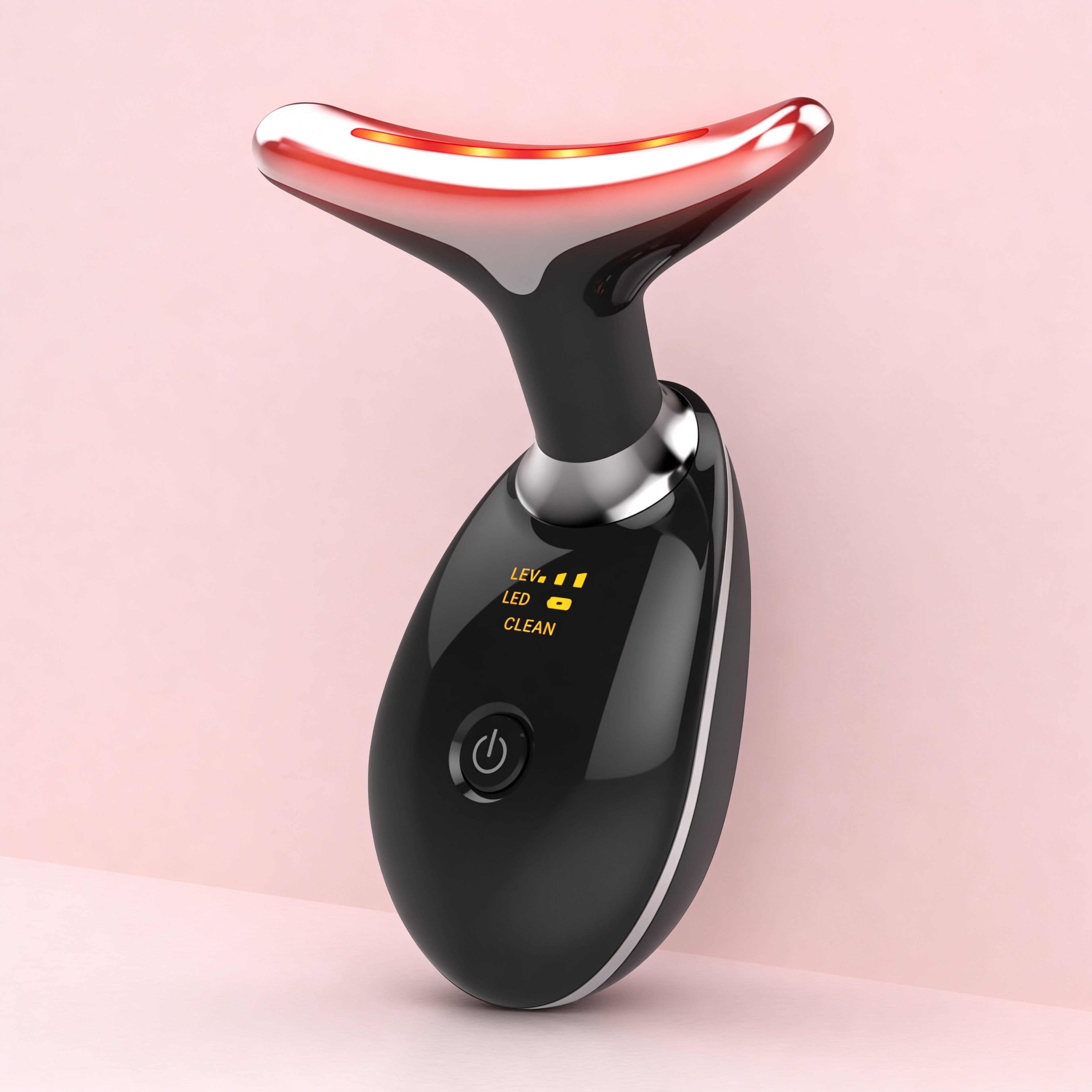 Black electronic device with a red light on a pink background