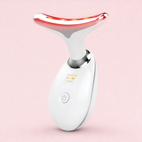 White and red skincare device on a pink background