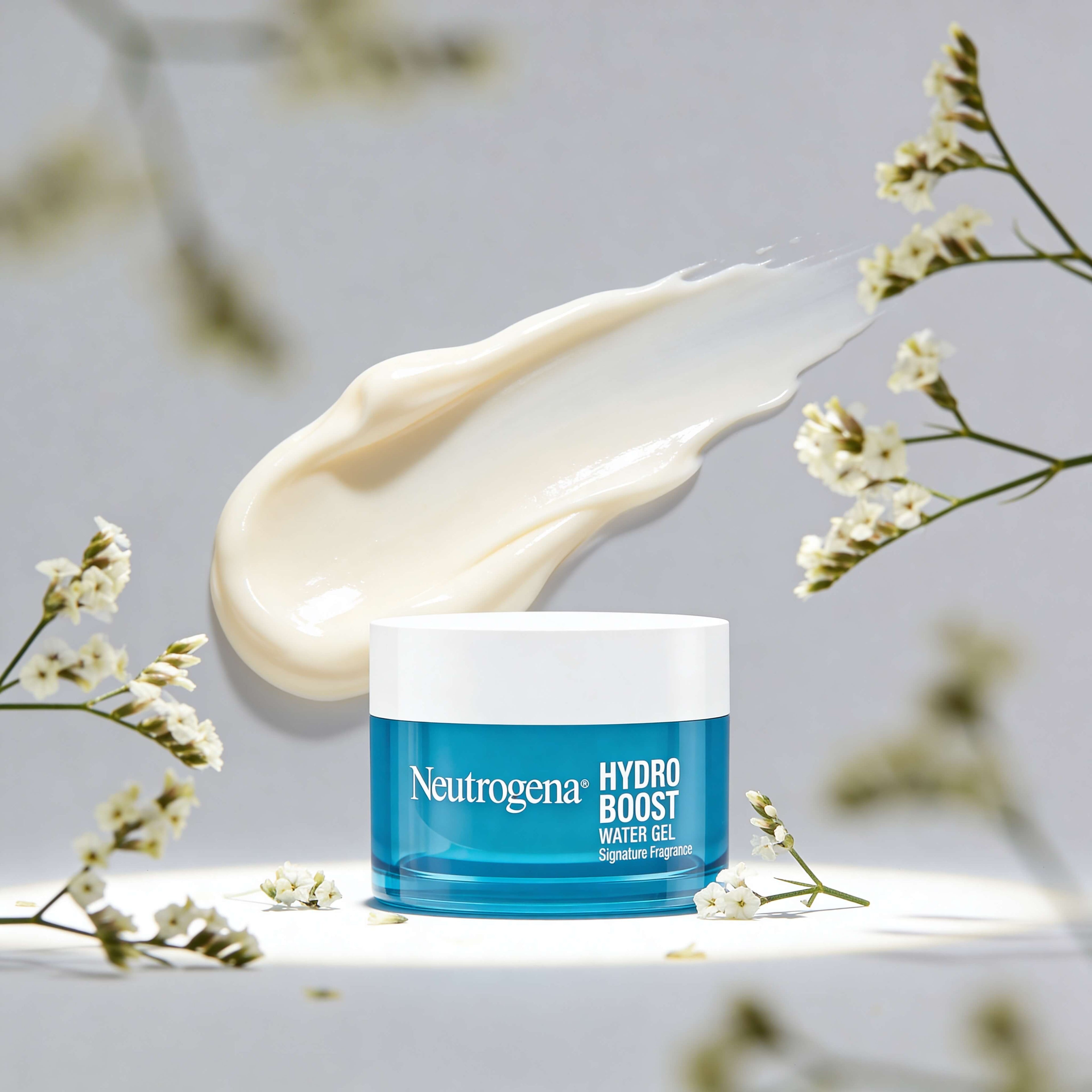 Neutrogena Hydro Boost Water Gel jar with cream swatch and flowers on a light background