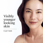 Woman with visibly younger looking skin on a white background