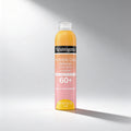 Neutrogena Invisible Sunscreen spray bottle on a gray background