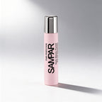 Pink bottle with silver cap on a gray background