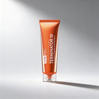 Tube of Acne Free Terminator 10 treatment on a gradient gray background